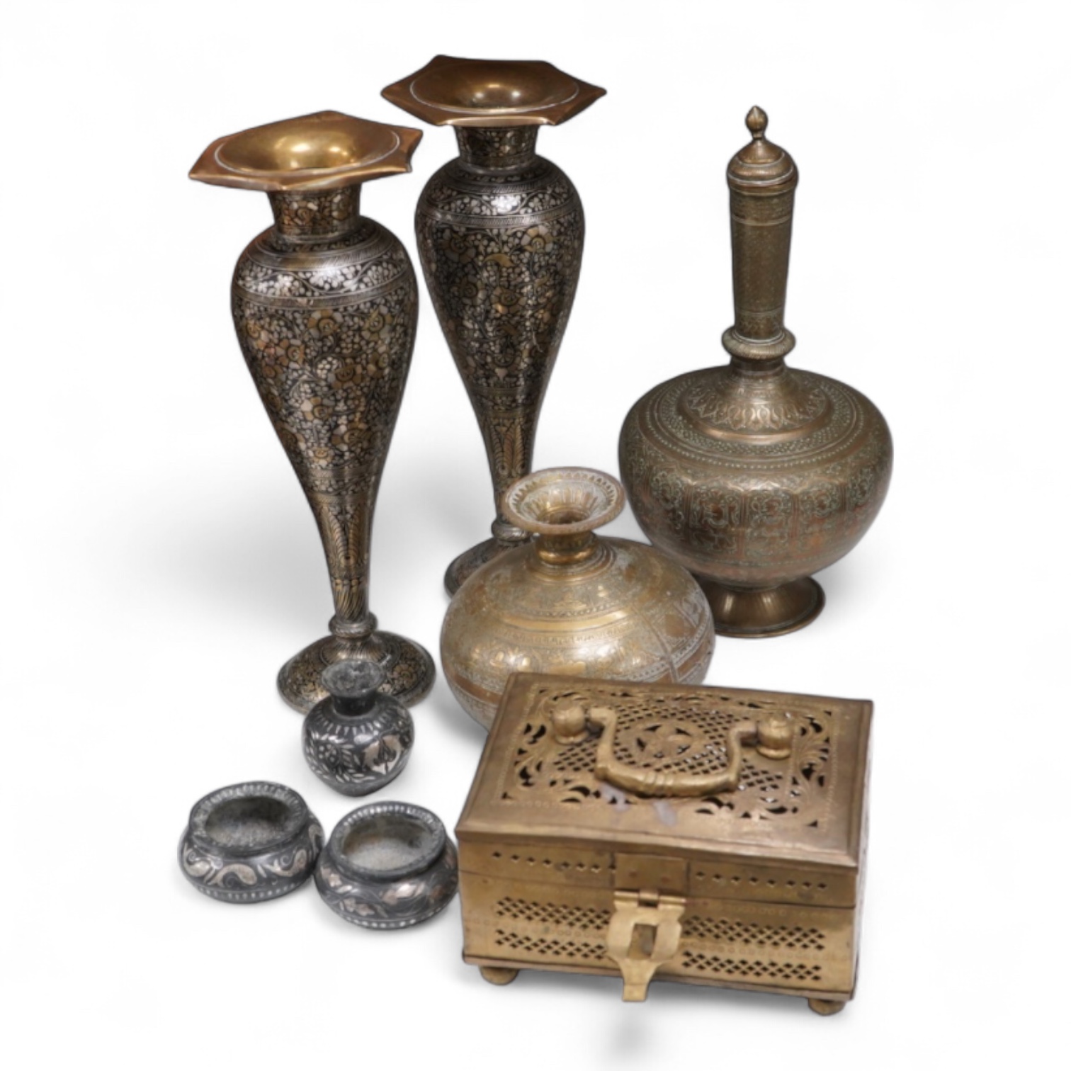 A collection of Indian brass and metalware to include a pierced casket box and Bidriware vases, largest 33cm high